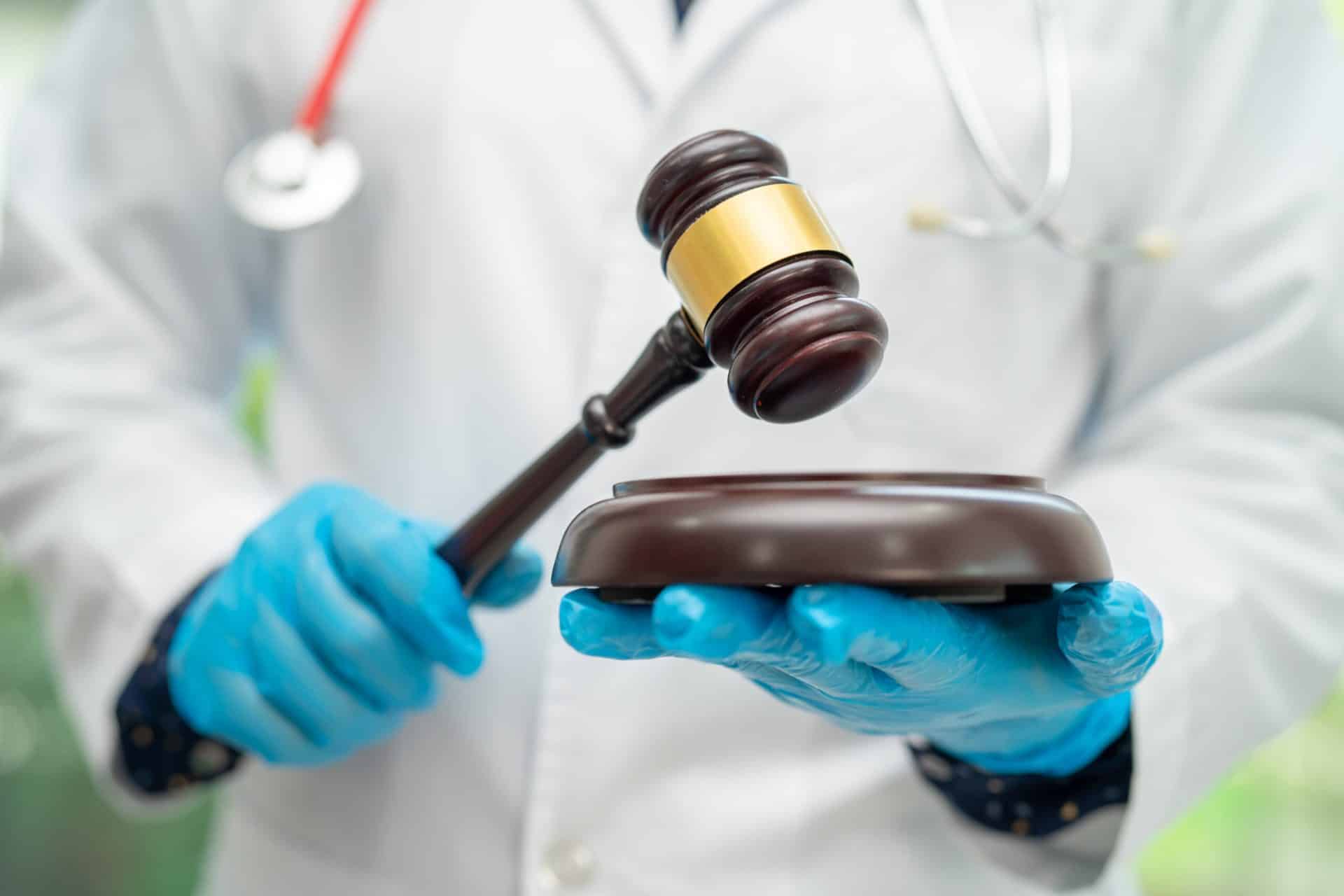 Nexus letter for sleep apnea VA disability claims A physician in a white coat holding a judge’s gavel, the medical-legal nexus a sleep apnea nexus letter establishes between a VA disability diagnosis and military service.